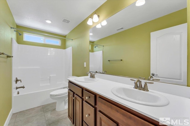 bathroom with a sink, tub / shower combination, toilet, and visible vents