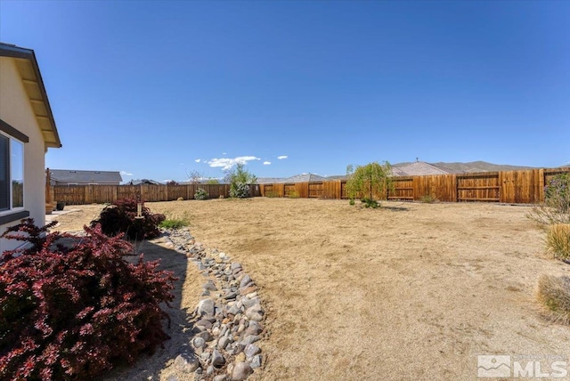 view of yard with a fenced backyard