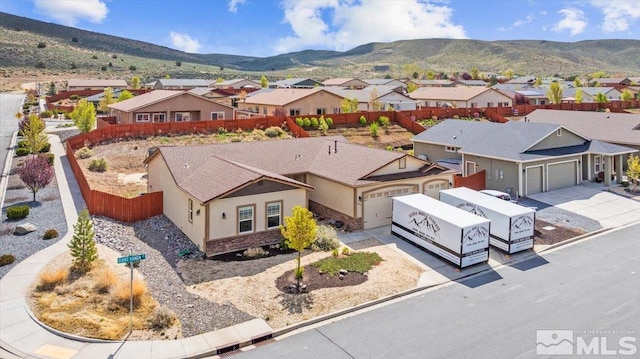 drone / aerial view with a residential view and a mountain view