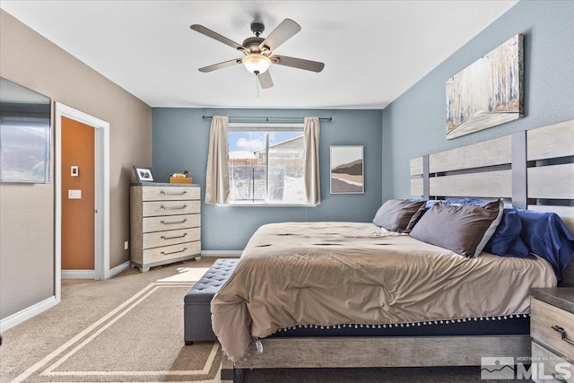 bedroom with carpet floors, baseboards, and a ceiling fan