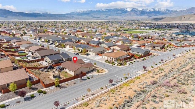 drone / aerial view with a residential view and a mountain view