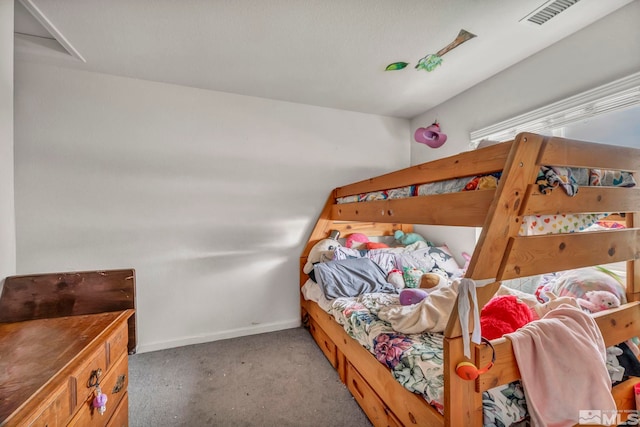 carpeted bedroom with baseboards and visible vents