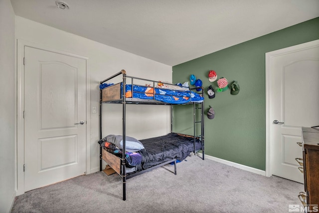 carpeted bedroom with baseboards
