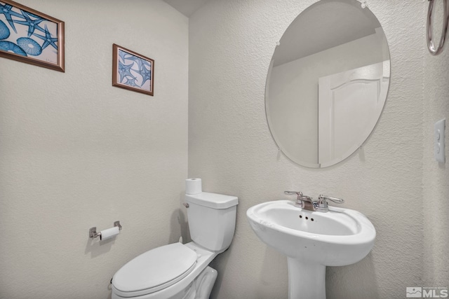 bathroom with a sink and toilet
