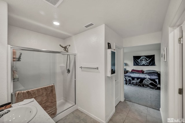 ensuite bathroom with visible vents, ensuite bath, tile patterned floors, and a shower stall