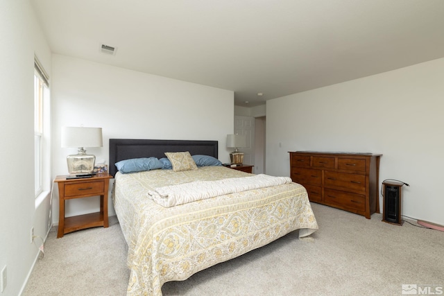 bedroom featuring carpet flooring, baseboards, and visible vents