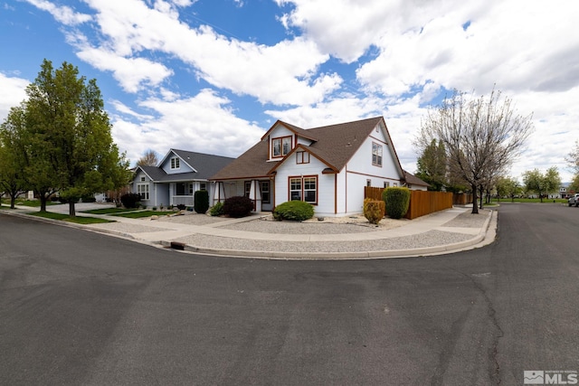 view of front of house featuring fence