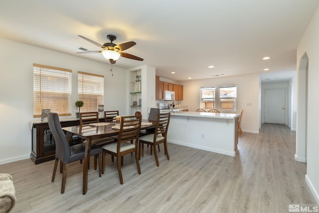 dining space with light wood-style floors, baseboards, ceiling fan, and recessed lighting