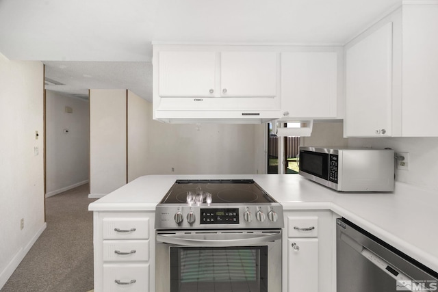 kitchen featuring stainless steel appliances, under cabinet range hood, light countertops, and white cabinetry