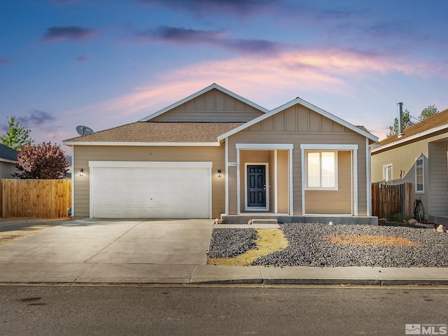 ranch-style house with fence, board and batten siding, concrete driveway, and a garage