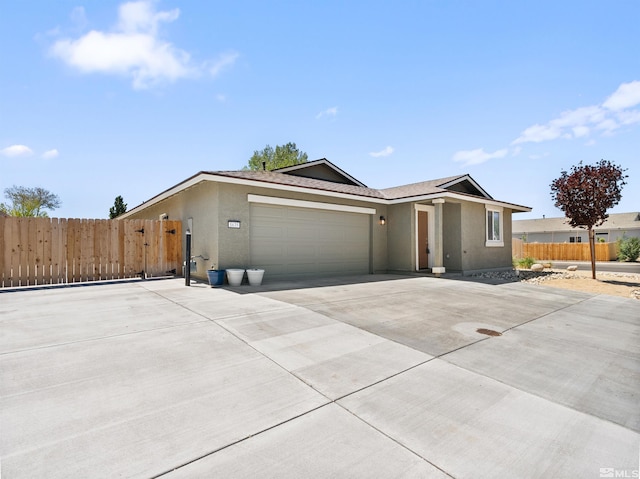 ranch-style home featuring stucco siding, a garage, fence, and concrete driveway