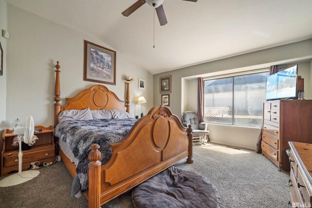 carpeted bedroom featuring vaulted ceiling and ceiling fan
