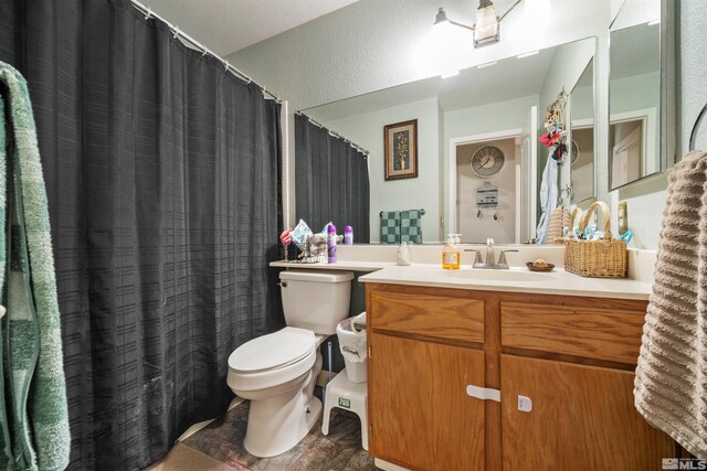 full bath featuring toilet and vanity