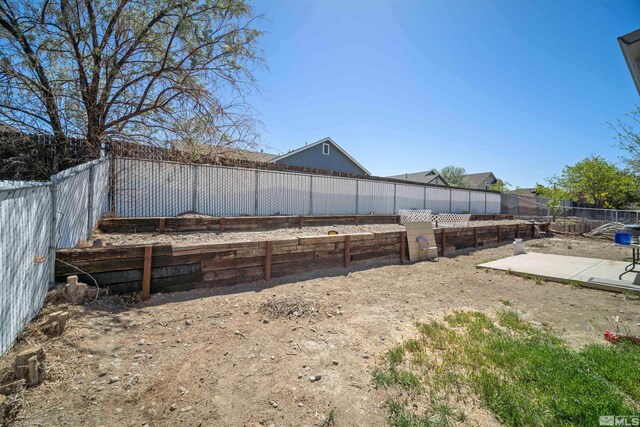 fenced backyard with a patio