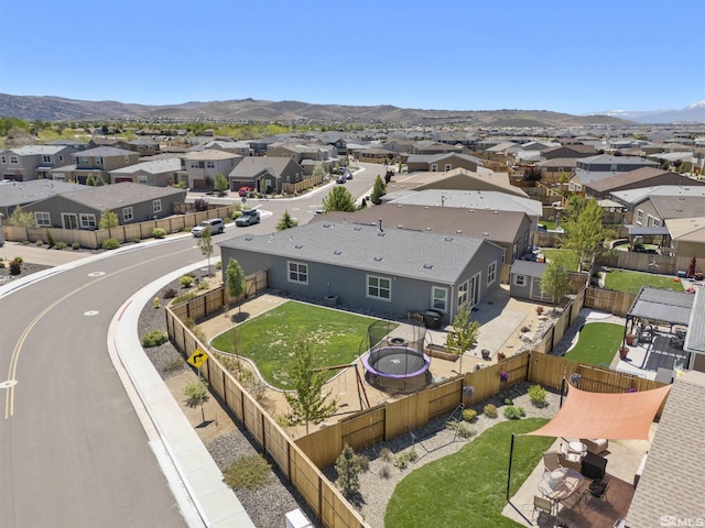 aerial perspective of suburban area featuring a mountain backdrop