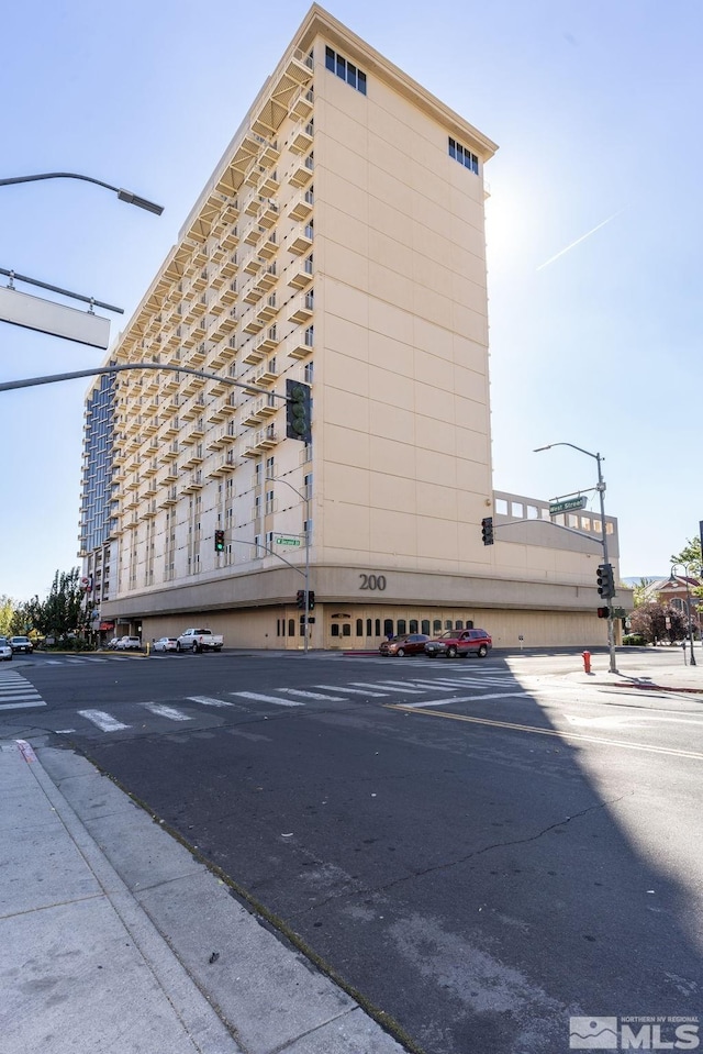 view of property with uncovered parking