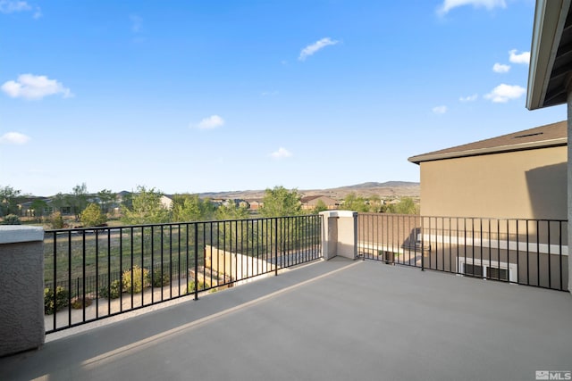 view of patio featuring a balcony