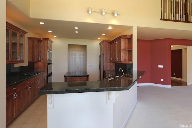 kitchen featuring a breakfast bar, open shelves, recessed lighting, a peninsula, and stainless steel appliances