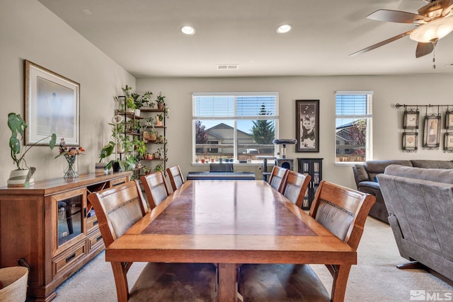 dining space featuring light colored carpet, a ceiling fan, and recessed lighting
