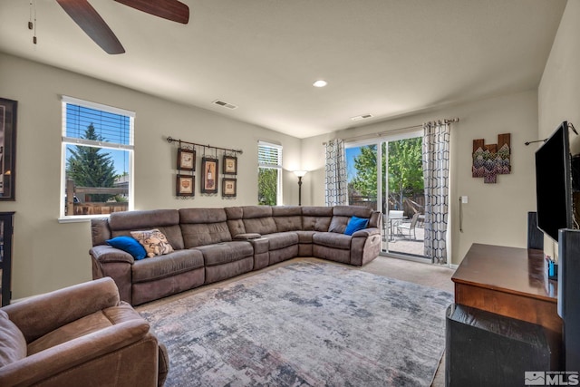 carpeted living room featuring a ceiling fan and recessed lighting