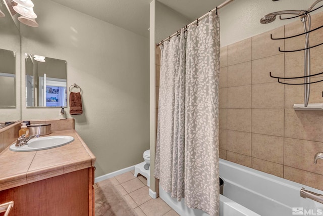 bathroom with toilet, tile patterned flooring, vanity, shower / bath combination with curtain, and baseboards