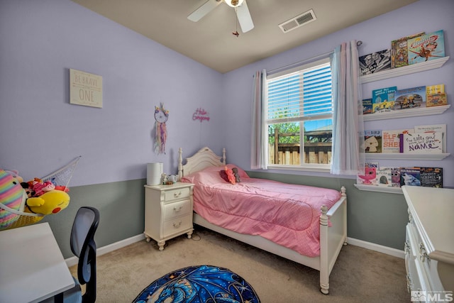 bedroom featuring light carpet, ceiling fan, and baseboards