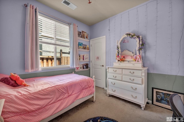 bedroom featuring light colored carpet
