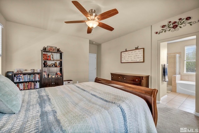 tiled bedroom with ceiling fan and connected bathroom