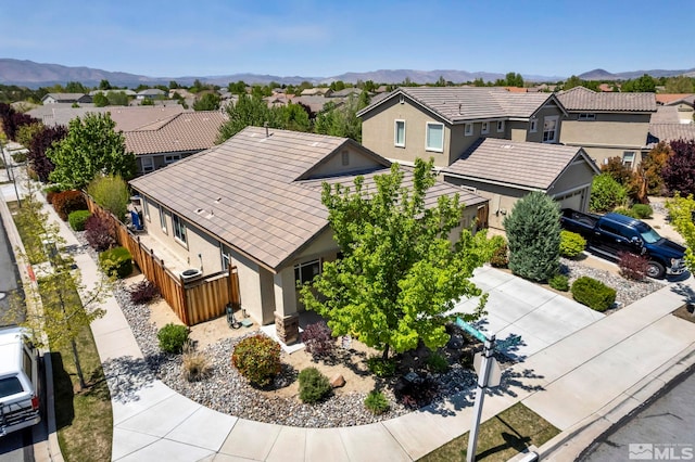 aerial perspective of suburban area with a mountain backdrop