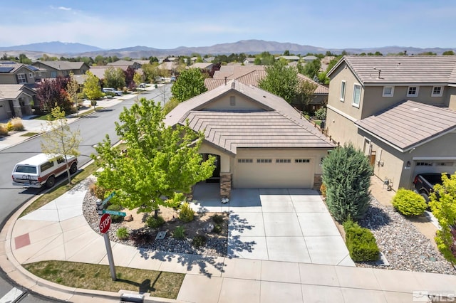 aerial perspective of suburban area featuring a mountain backdrop