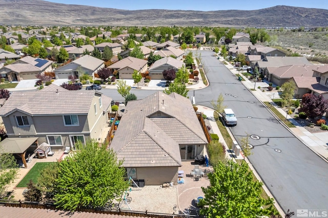 aerial view of residential area with a mountainous background