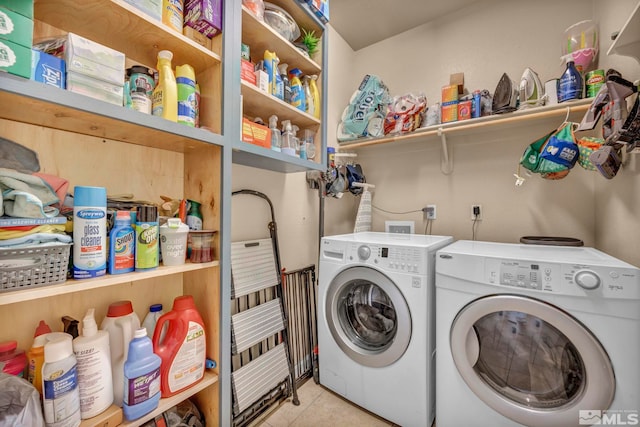 washroom with washing machine and dryer