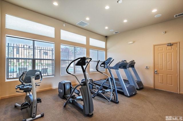workout area featuring plenty of natural light, recessed lighting, and baseboards