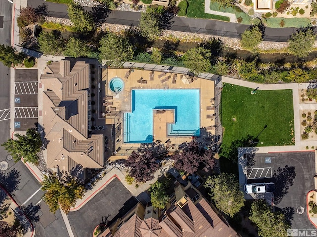 view of property location with a pool area