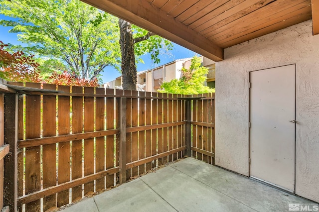 view of patio featuring fence