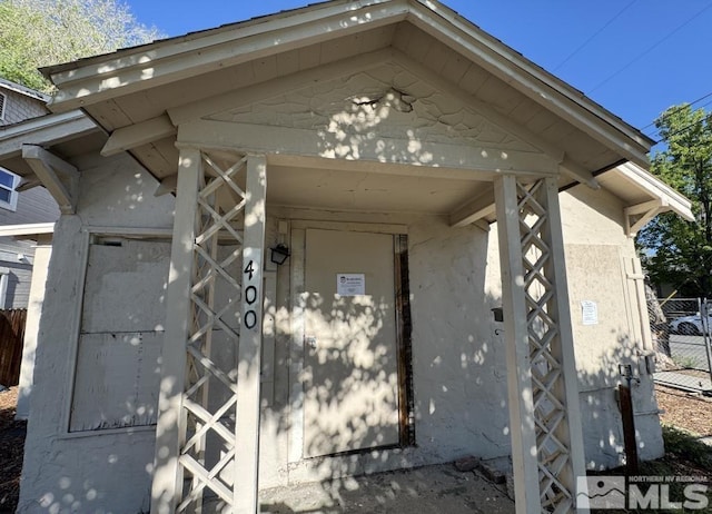 property entrance featuring fence
