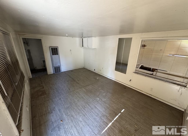 unfurnished living room with wood finished floors