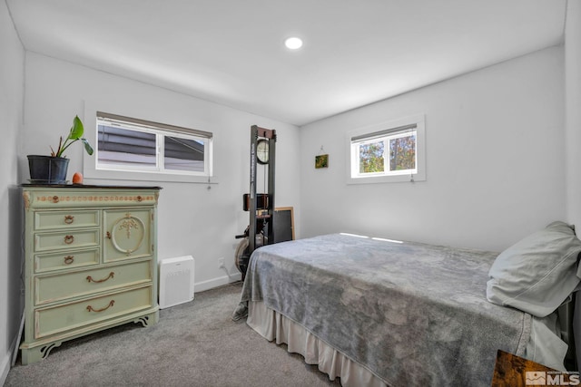 carpeted bedroom with recessed lighting and baseboards