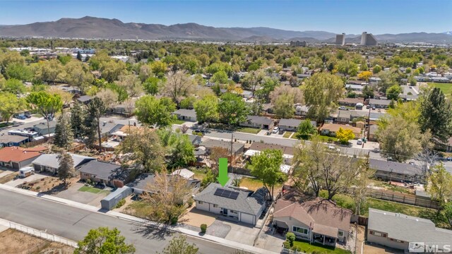 aerial perspective of suburban area featuring a mountain backdrop