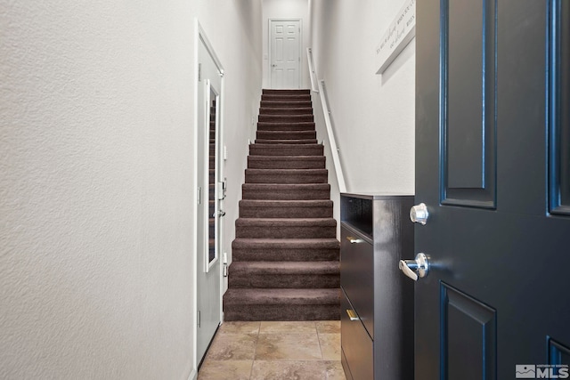 stairs with a textured wall