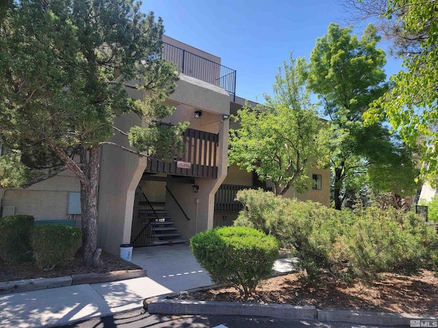 view of property with stairway