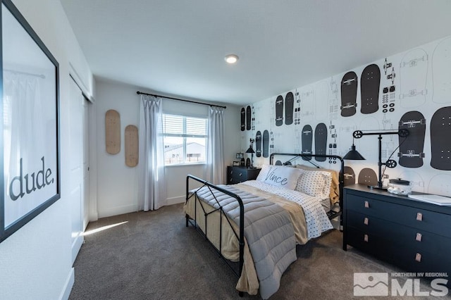 bedroom with carpet flooring and baseboards