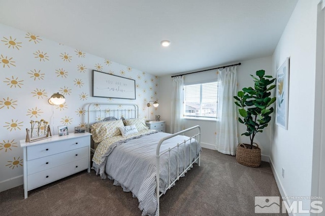 carpeted bedroom with baseboards and wallpapered walls