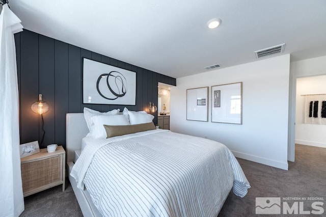 bedroom featuring carpet and baseboards
