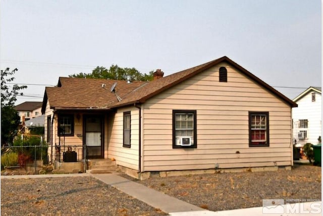 view of front facade with a chimney