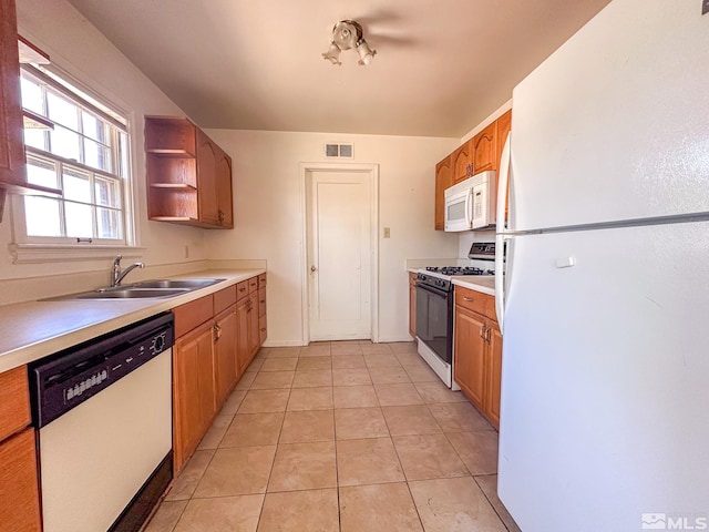 kitchen featuring white appliances, a sink, open shelves, light countertops, and light tile patterned flooring
