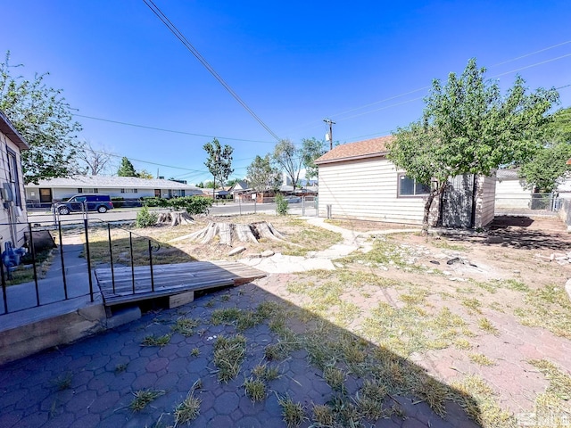 view of yard featuring fence and a wooden deck