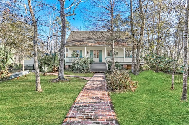 bungalow-style house featuring covered porch and a front lawn