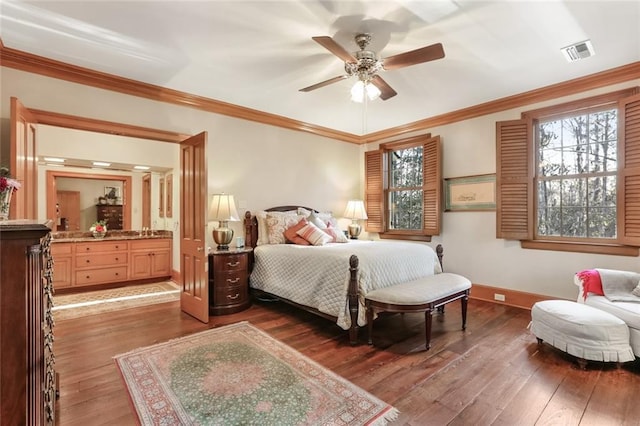 bedroom featuring ceiling fan, dark wood-type flooring, ornamental molding, and sink