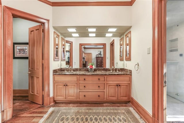 bathroom with wood-type flooring, double sink, and oversized vanity